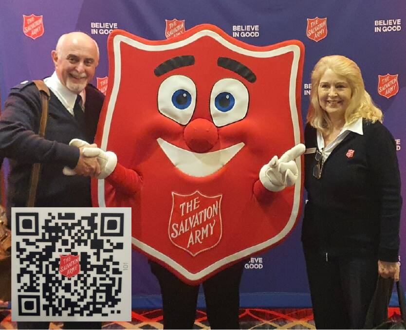 Brian and Jean Rennie with the Salvation Army mascot Shieldy. Inset is the Red Shield Appeal QR code. Picture supplied.