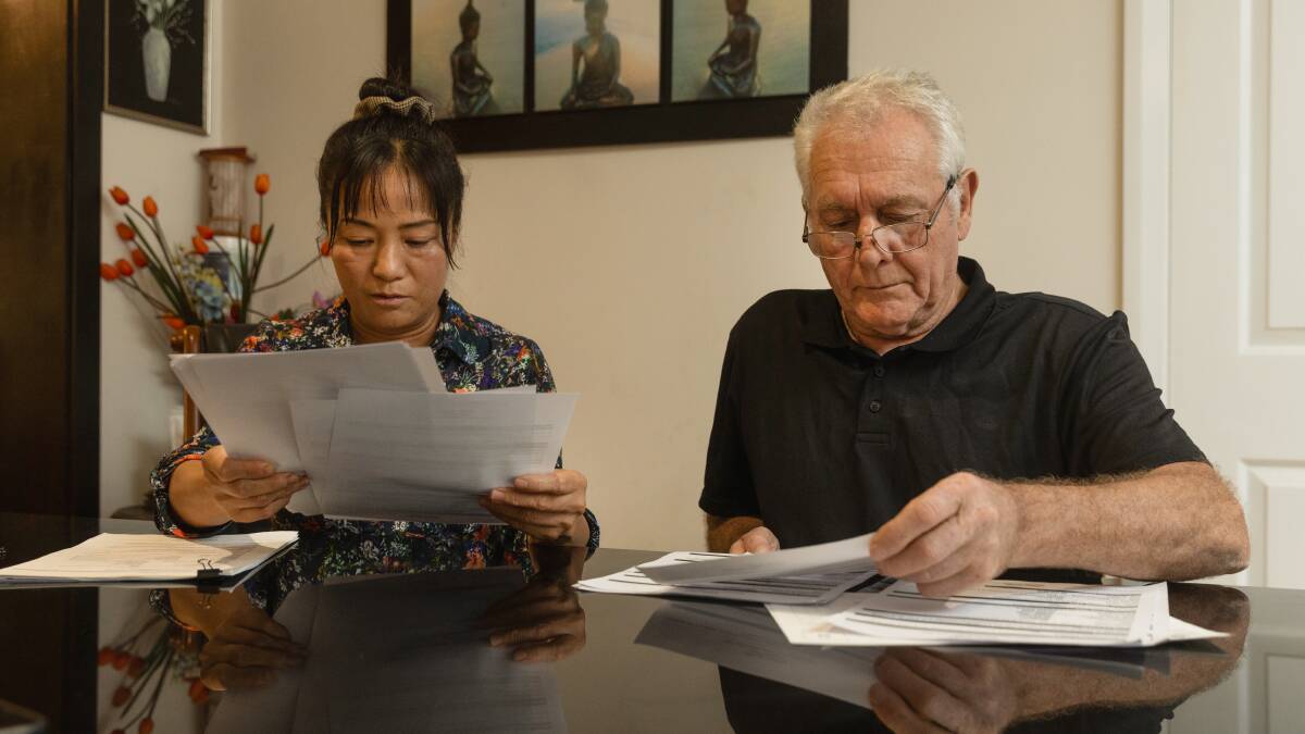 Xianggao and Graham looking over their paperwork. Picture by Marina Neil