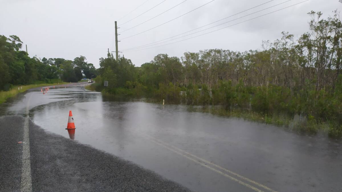 Water over Nelson Bay Road between Frost and Gan Gan roads on March 22, 2021. Heavy rain and flooding in March 2021 caused significant damage to roads around Port Stephens.