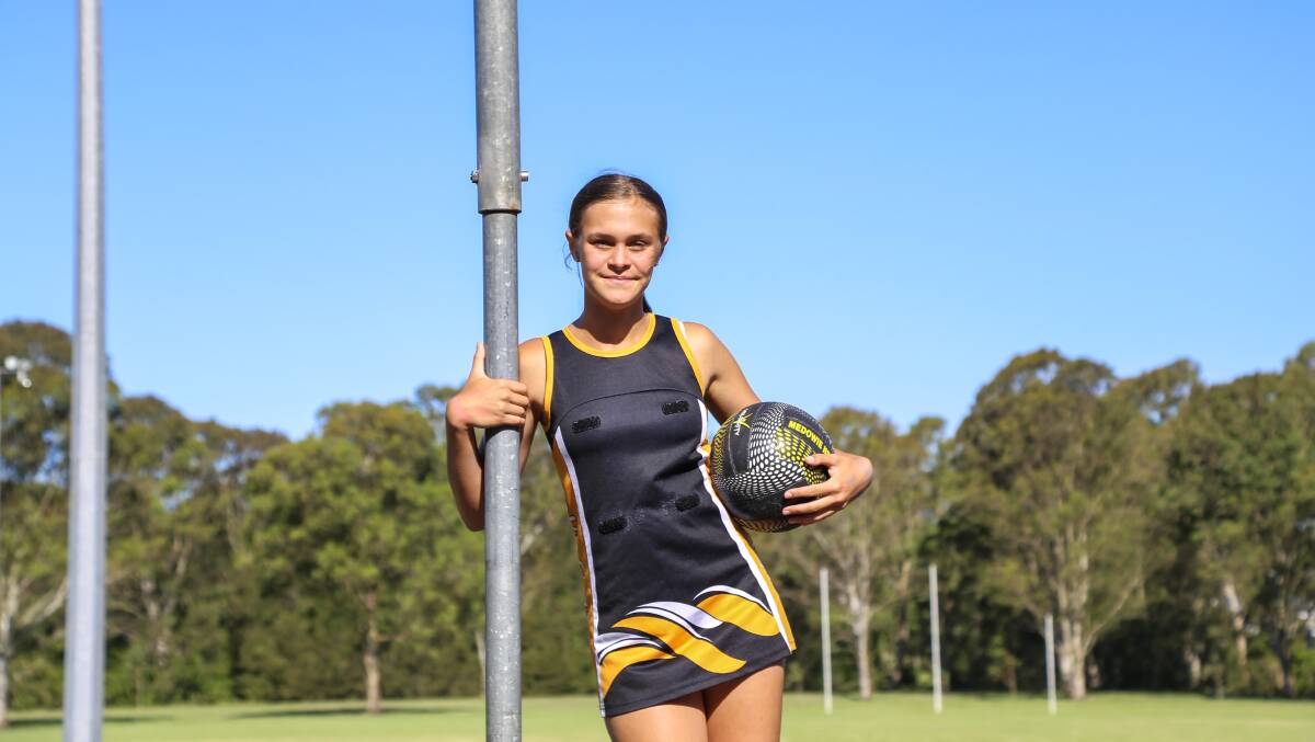 Ella O'Loughlin, aged 12, has created the design for Medowie Netball Club's new uniforms and balls. 