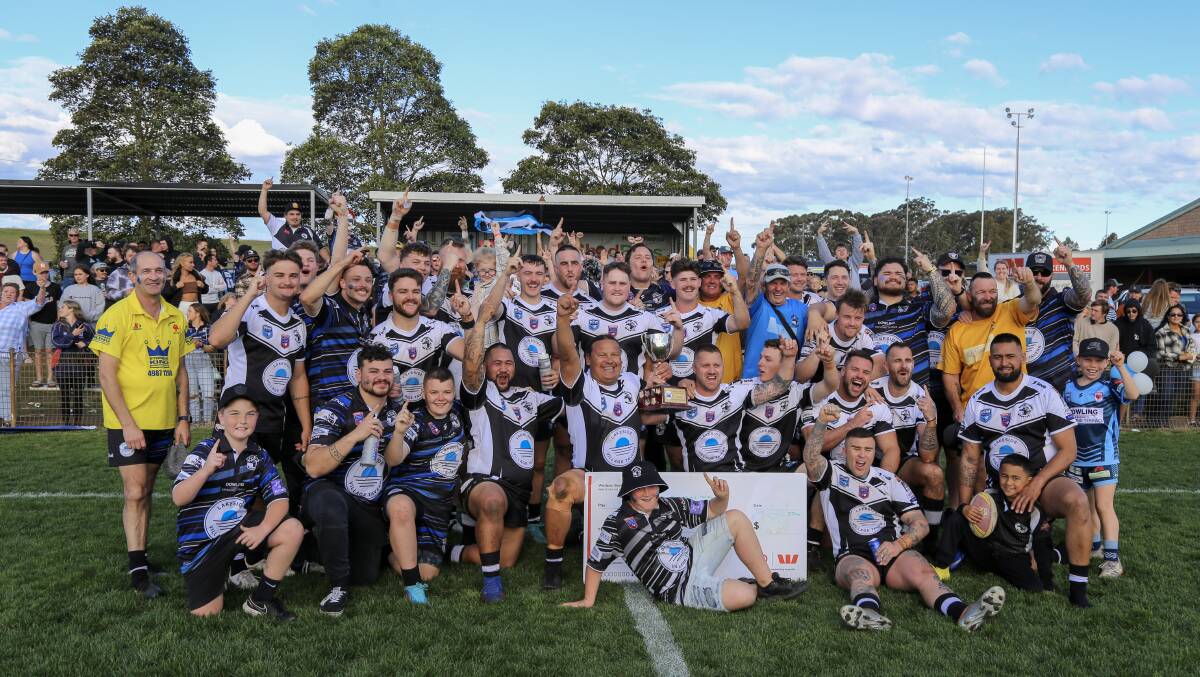 The Raymond Terrace Magpies celebrating with supporters after winning the 2022 NHRL C-grade grand final. Roach and Handsaker front and centre with the Cup.