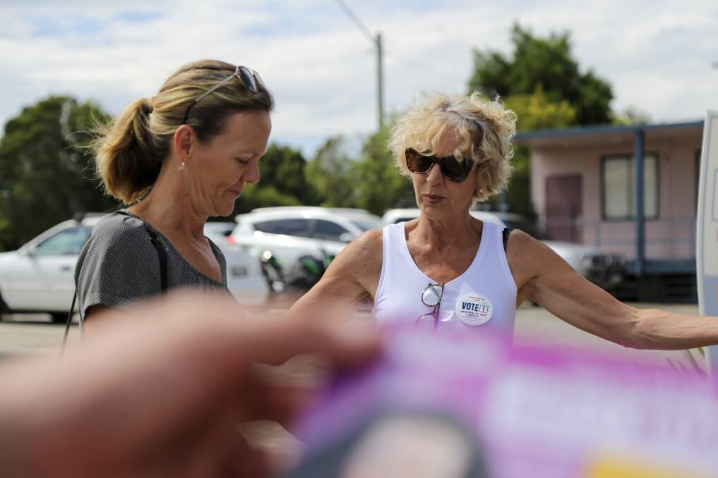Candidates and voters at the Raymond Terrace early voting centre on Thursday, March 23. Pictures by Ellie-Marie Watts