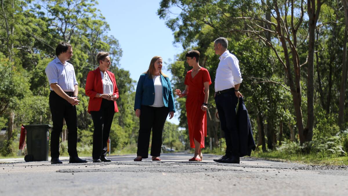 Port Stephens deputy mayor Giacomo Arnott and councillor Leah Anderson with Jenny Aitchison, Kate Washington and John Graham in Rookes Road, Salt Ash for a Labor roads election announcement. Picture by Ellie-Marie Watts