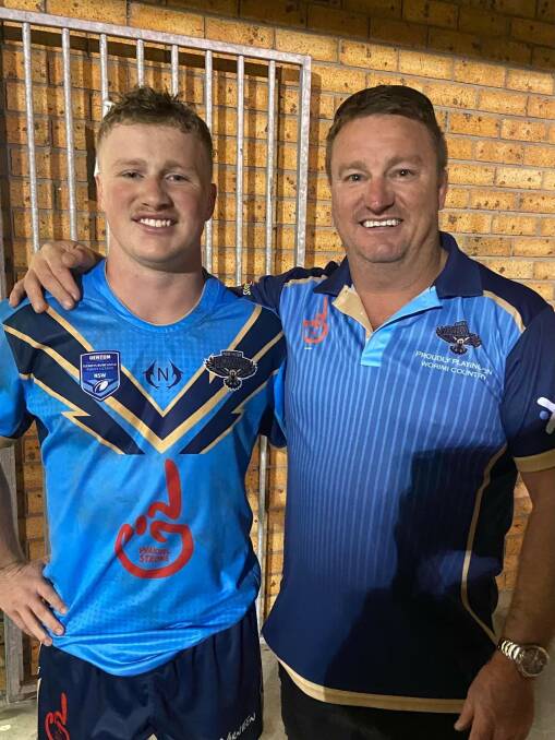 Hawks first grade debutant and local junior Jack Langdon with his father Sean Langdon before Thursday night's game (April 6) against the Macquarie Scorpions.