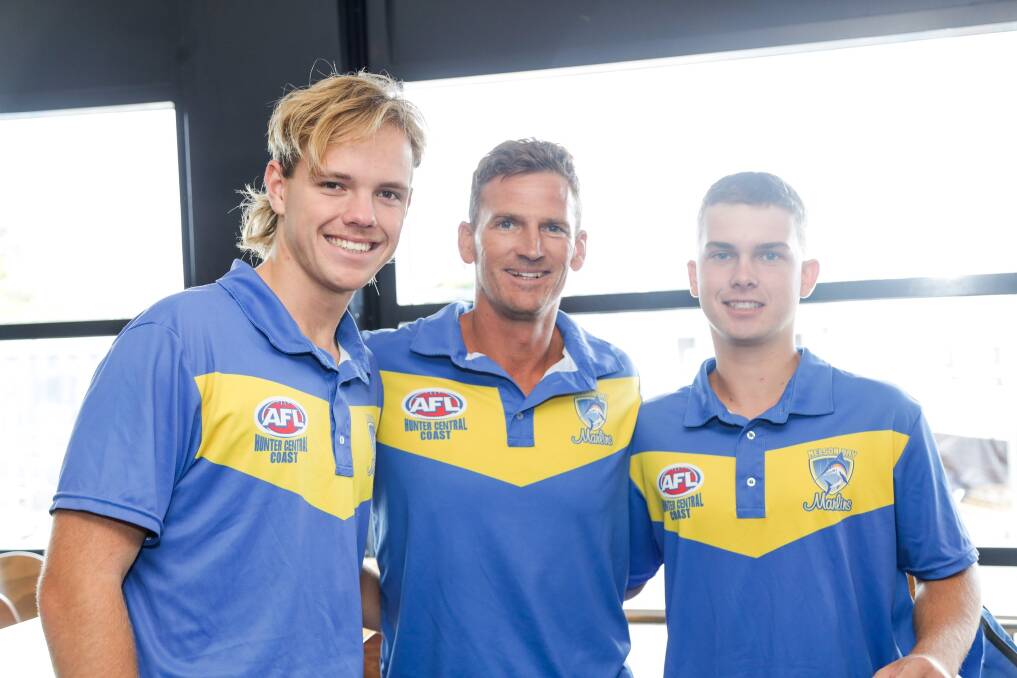 Nelson Bay Marlins players Harrison Lack and Mitch Walls with coach Nic Griffith at the AFL Hunter Central Coast season launch in Belmont on April 2. Picture by LookPro Photography 