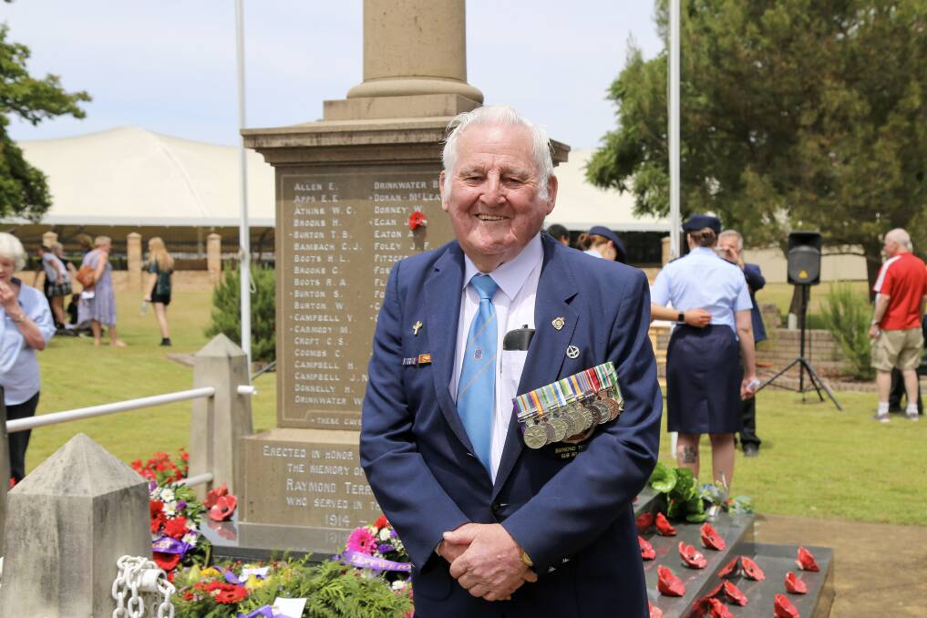 Jim Walker at the Raymond Terrace Remembrance Day service on Friday, November 11. Mr Walker received a 50 year membership certificate to the RSL.