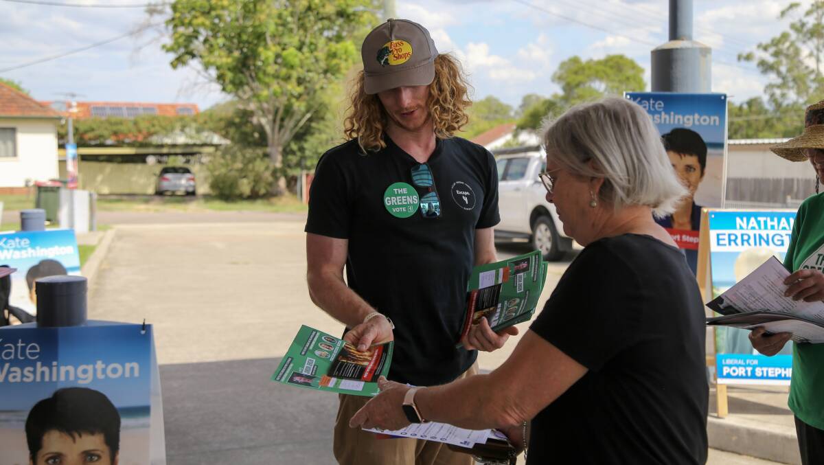 Greens candidate Jordan Jensen speaking with a voter in Raymond Terrace on Thursday, March 23.