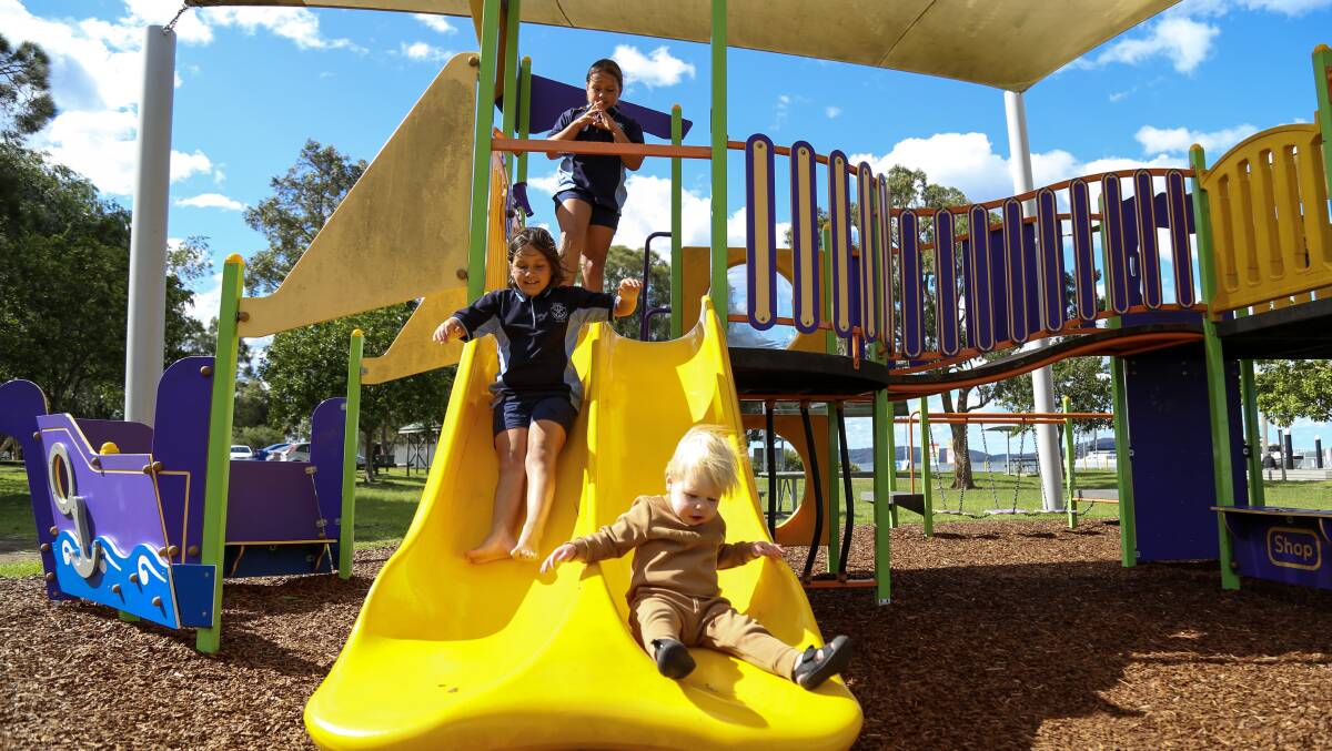 Twins Charlie and Mia Henderson, aged 9, on the Henderson Park playground with Jesse Murray, 18 months. Tillifest22 will be staged in the park on Saturday, November 19 from 10am to 9pm.