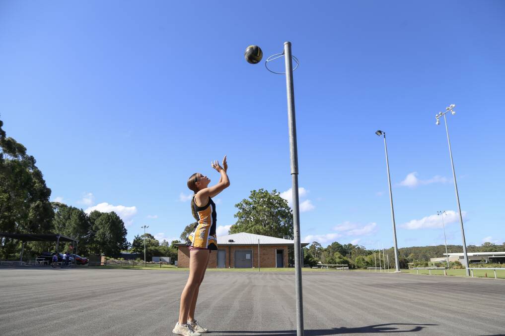 Worimi girl Ella O'Loughlin, aged 12, has created the design for Medowie Netball Club's new uniforms and balls. 