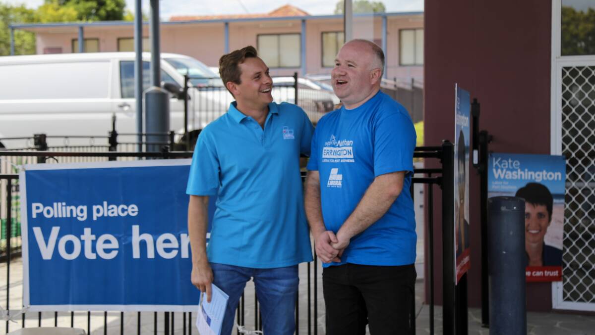 Parliamentary secretary for the Hunter, Taylor Martin MLC, with Liberal candidate for Port Stephens Nathan Errington at Raymond Terrace pre-poll on Thursday, March 23. Picture by Ellie-Marie Watts 