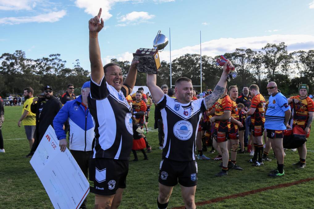Raymond Terrace Magpies co-captains Brooke Roach and Luke Handsaker with the silverware after defeating Awabakal Eagles 32-8 in the NHRL C-grade grand final on September 10, 2022. Picture: Ellie-Marie Watts
