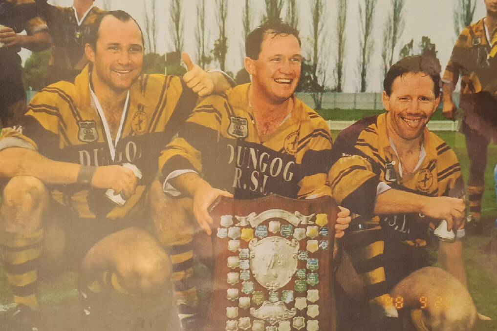 Tony Townsend (right) with brothers Michael and Jason after winning a premiership with the Dungog Warriors in the 1990s. Picture supplied by Warriors president Peter Hudson.