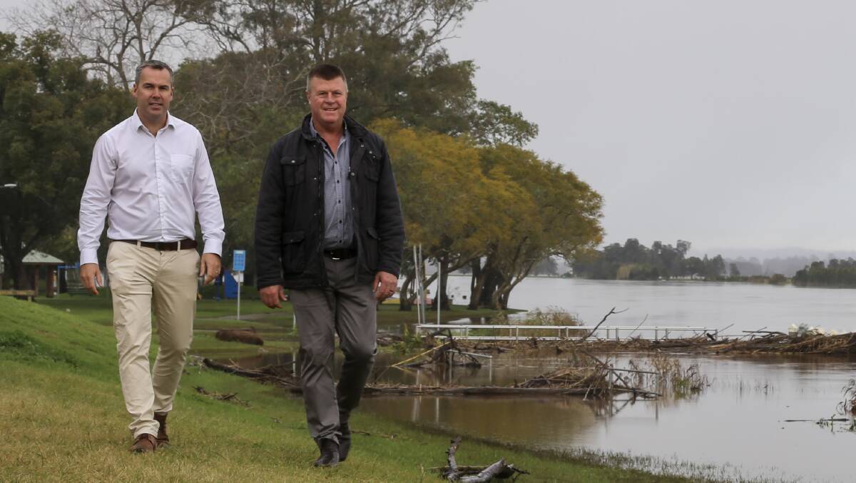 Port Stephens Mayor Ryan Palmer and Port Stephens Council's facilities and services group manager Greg Kable walking along the Hunter River at Raymond Terrace following the July 2022 flood event.