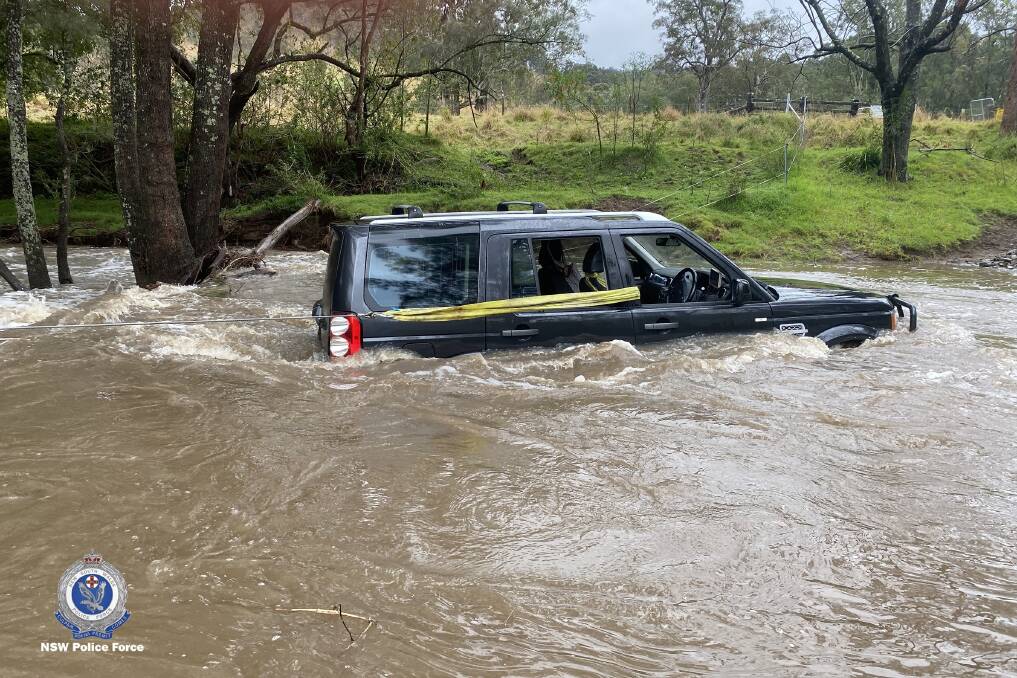 Image shows the submerged 4WD that Senior Constable Hansen rescued three people from on Thursday, September 22. 