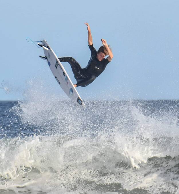 An airborne Mikey Clayton-Brown surfing at Birubi Beach. Picture by Phillip Craig Photography