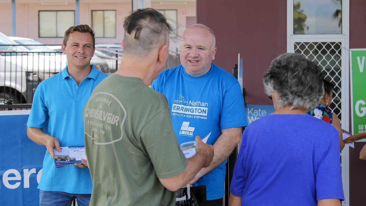 Liberal candidate for Port Stephens Nathan Errington handing out how to vote cards in Raymond Terrace on Thursday, March 23. Picture by Ellie-Marie Watts