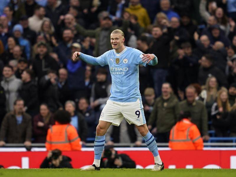 Erling Haaland made up for his earlier 'miss of the season' to score in Man City's 3-1 derby win. (AP PHOTO)