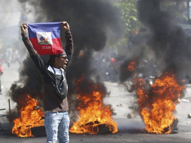The latest clashes in Haiti follow a string of protests that have been building for some time. (AP PHOTO)
