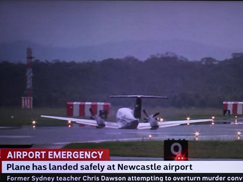A plane circled above a Newcastle airport for nearly two hours before making an emergency landing. (Supplied by Abc News/AAP PHOTOS)