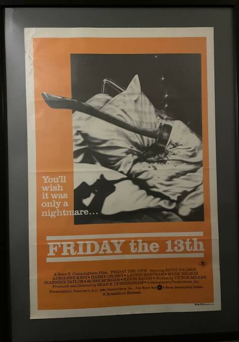 The original 'Friday the 13th' movie poster from the '80s hangs upstairs in the corridor of Nelson Bay Cinema. Picture by Alanna Tomazin