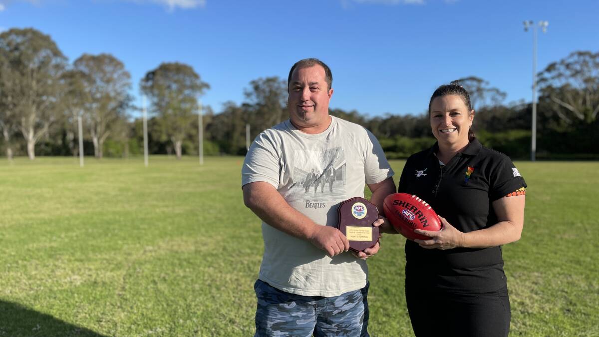 Port Stephens Power AFL Club's Nathan Ashpole and Josie Johnson receive an award for Auskick Centre of the Year in the Hunter and Central Coast region. Picture by Alanna Tomazin